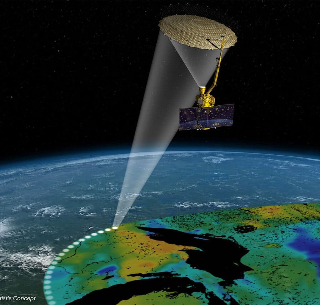 Artist's concept of SMAP observatory and its antenna-beam footprint. Credit: NASA.
