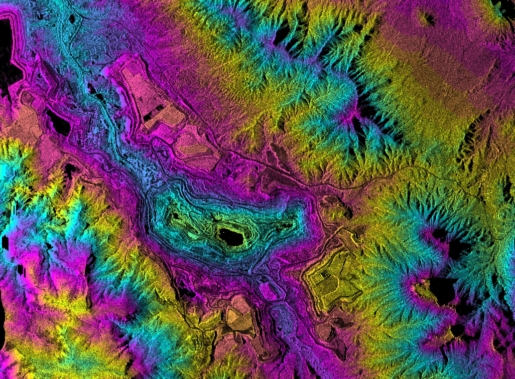Topographic radar data over the Ray Mine in central Arizona. Colors show elevation information from the mine pits in the center of the image up through the surrounding mountains. These data are being used for mine site and watershed characterization associated with environmental assessment of the area. Image NASA /JPL