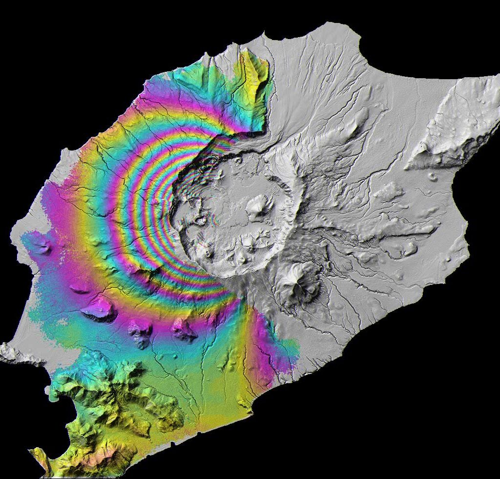 Color SAR image of Okmok Volcano, in the Aleutian Islands, It experienced deflation due to erruption. Each fringe, or color cycle shown here represents approximately 2.8 cm (1.1 in.) of ground movement.